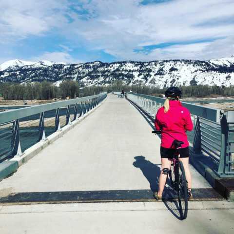 My wife in front of a bridge