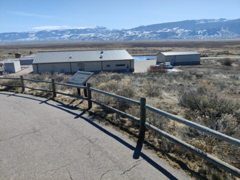 The view from the parking lot looking down at the Jackson National fish hatchery building.